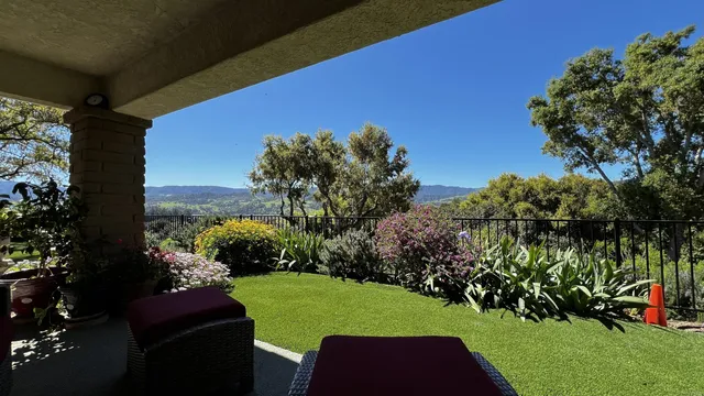 a yard with table and a garden