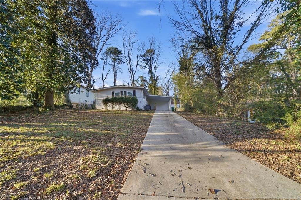 3024 Pasadena Drive Decatur, GA 30032 - Photo 1 of 28 a front view of a house with a yard