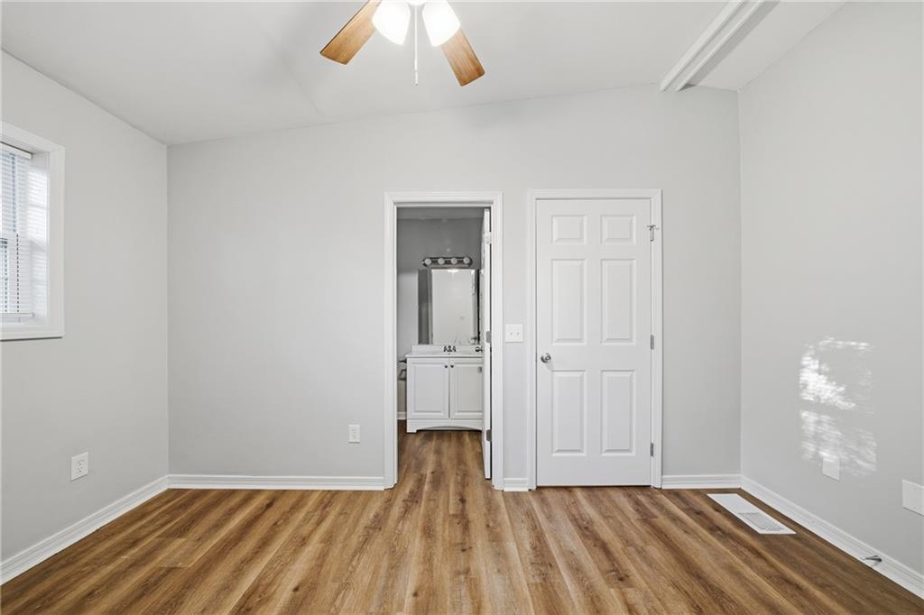 3024 Pasadena Drive Decatur, GA 30032 - Photo 15 of 28 wooden floor in an empty room with a window