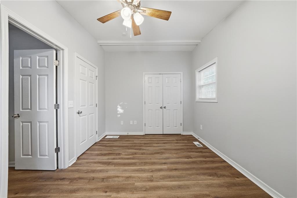 3024 Pasadena Drive Decatur, GA 30032 - Photo 16 of 28 wooden floor in an empty room with a window