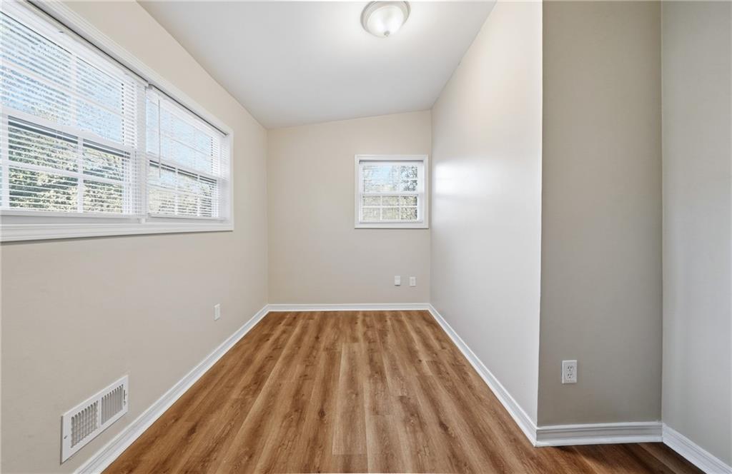 3024 Pasadena Drive Decatur, GA 30032 - Photo 18 of 28 a view of a room with wooden floor and windows