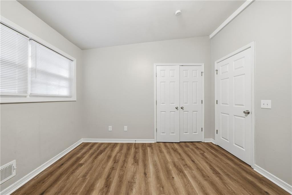 3024 Pasadena Drive Decatur, GA 30032 - Photo 20 of 28 a view of a room with wooden floor and windows