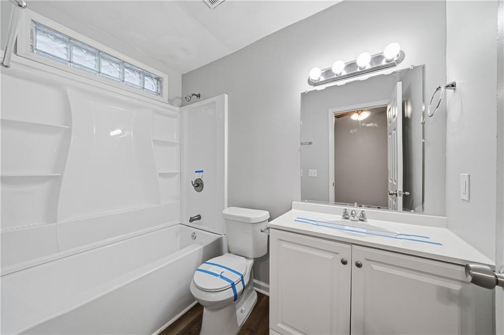 3024 Pasadena Drive Decatur, GA 30032 - Photo 21 of 28 a bathroom with a bathtub shower sink vanity mirror and toilet
