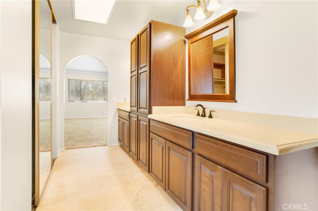 3488 Radcliffe Road Thousand Oaks, CA 91360 - Photo 17 of 23 a bathroom with a double vanity sink and mirror