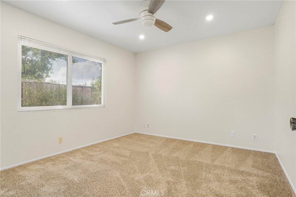 3488 Radcliffe Road Thousand Oaks, CA 91360 - Photo 20 of 23 an empty room with a window and ceiling fan