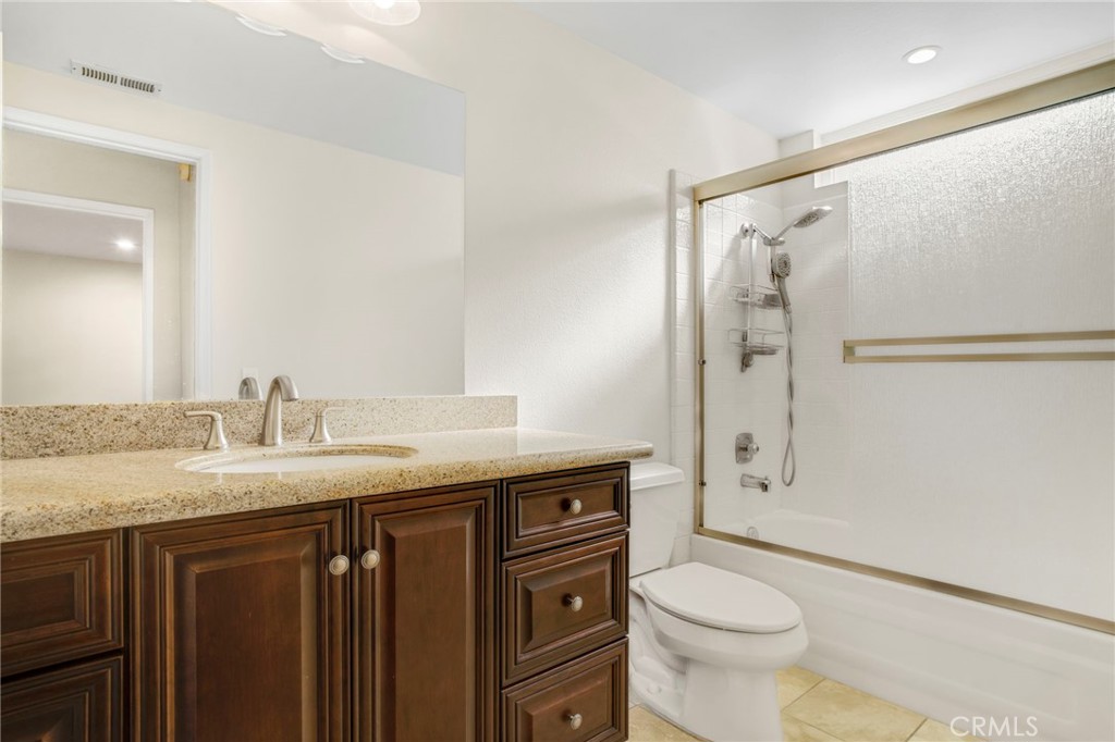 3488 Radcliffe Road Thousand Oaks, CA 91360 - Photo 21 of 23 a bathroom with a granite countertop sink toilet and shower
