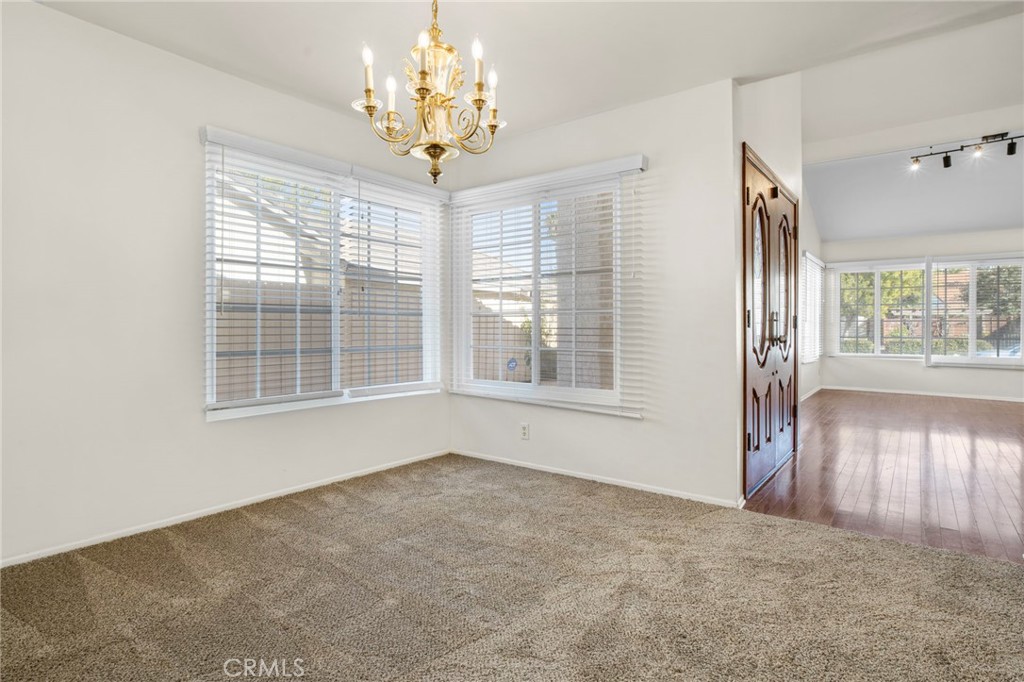 3488 Radcliffe Road Thousand Oaks, CA 91360 - Photo 8 of 23 an empty room with wooden floor and windows
