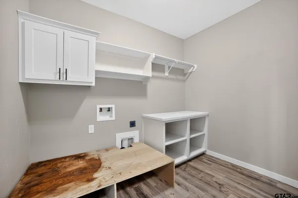 a view of bedroom with furniture and wooden floor