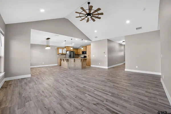 a view of a kitchen with a wooden floor