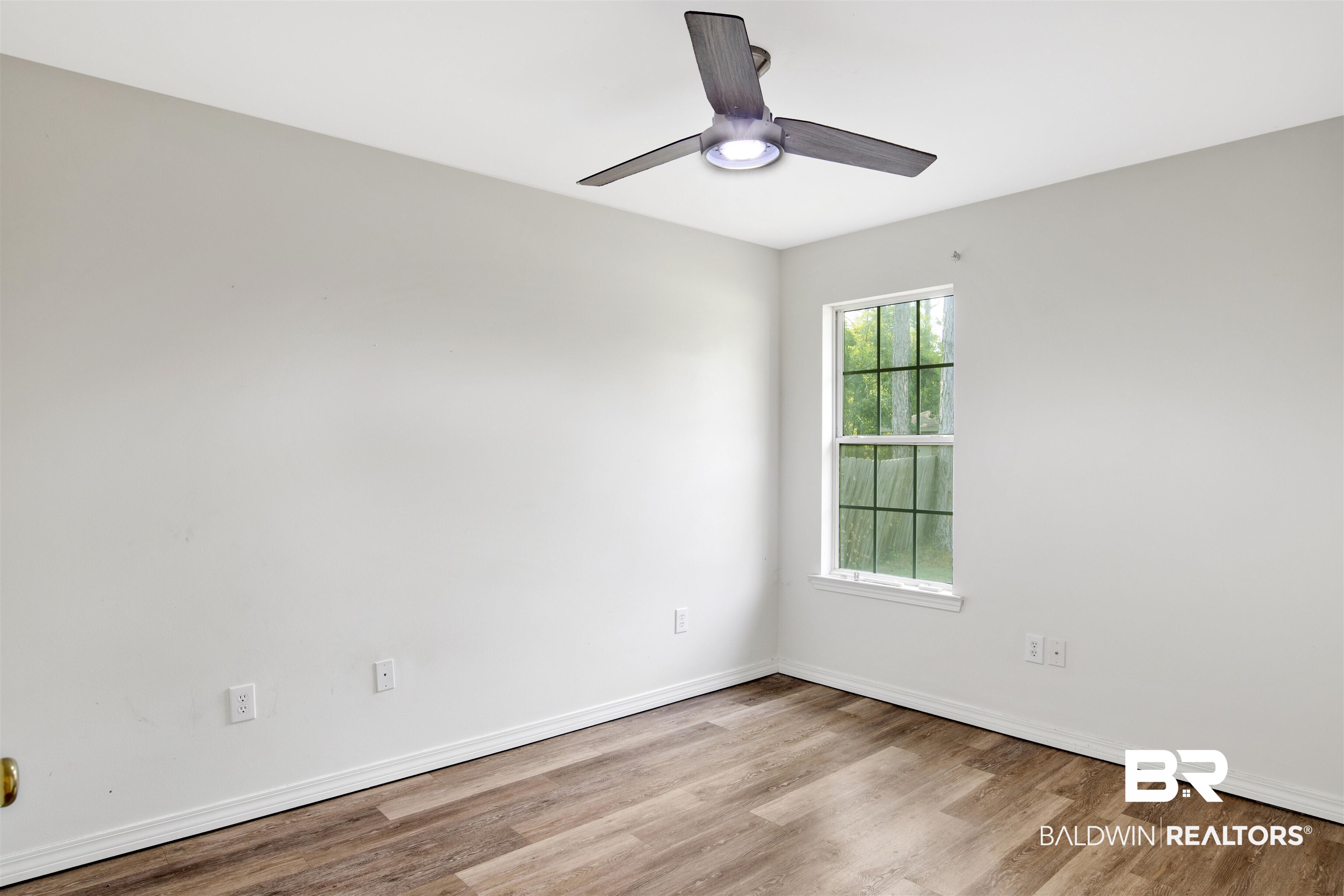 24384 Sailfish Lane Orange Beach, AL 36561 - Photo 11 of 23 Spare room with ceiling fan and hardwood / wood-style floors