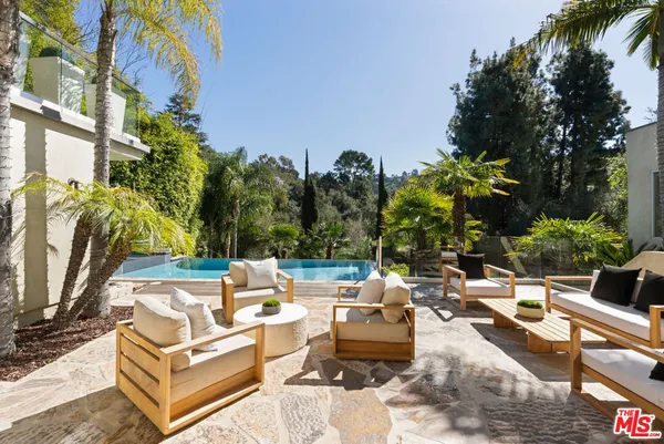 a view of a patio with swimming pool
