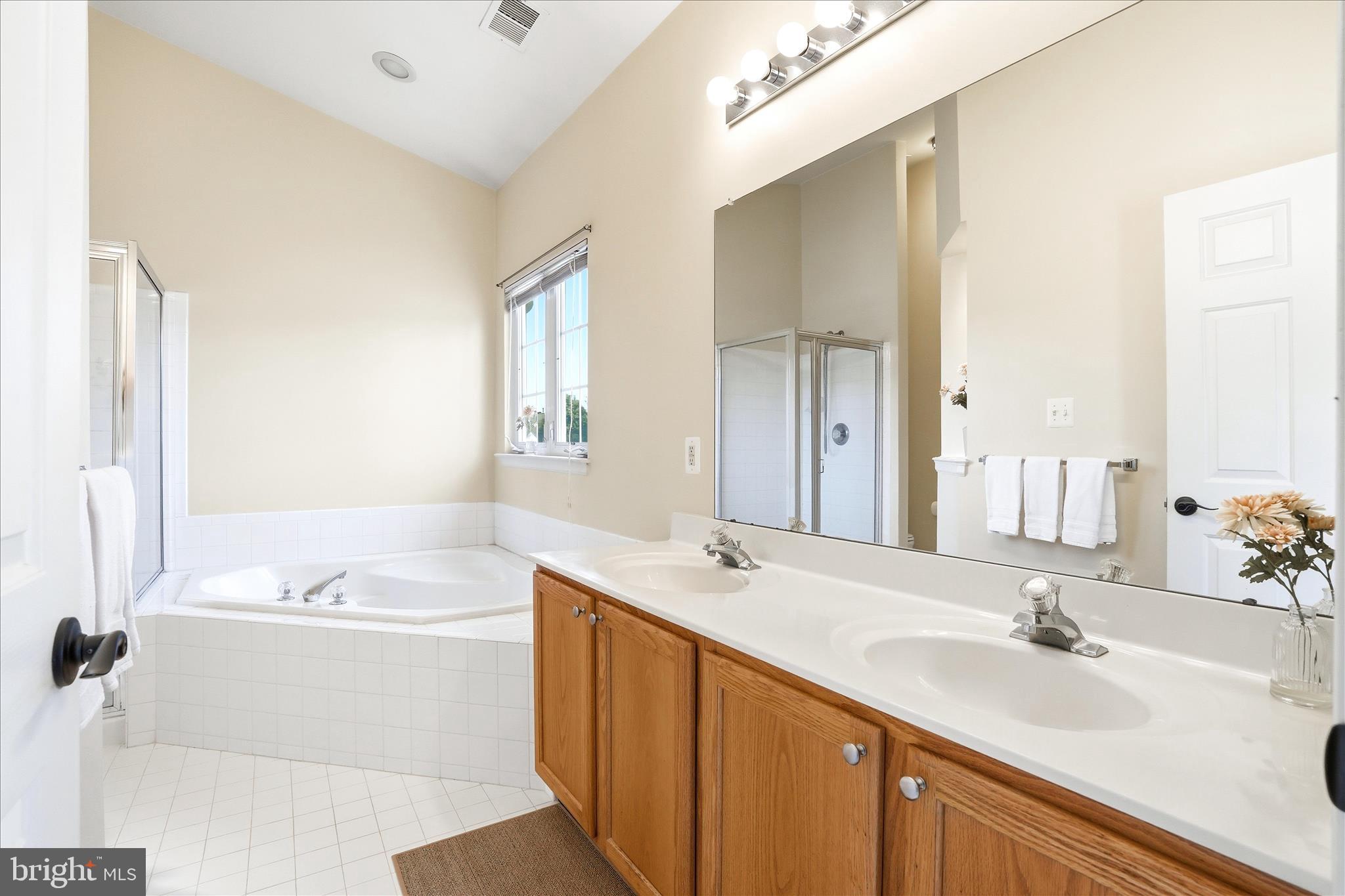 9009 Bealls Farm Road Frederick, MD 21704 - Photo 19 of 41 a bathroom with a double vanity sink mirror and double