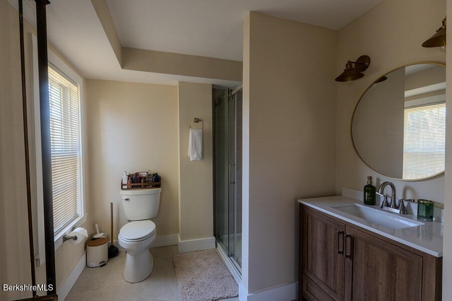 10 Goodell Road Lanesborough, MA 01237 - Photo 13 of 67 a bathroom with a toilet sink and mirror