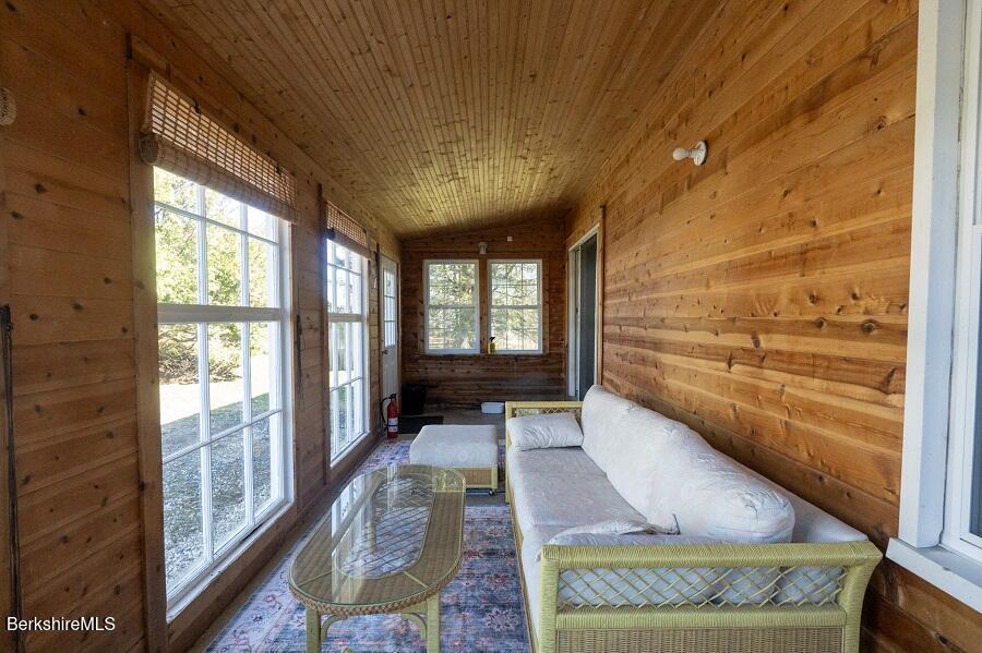10 Goodell Road Lanesborough, MA 01237 - Photo 15 of 67 a very nice looking room with a large window and wooden floor