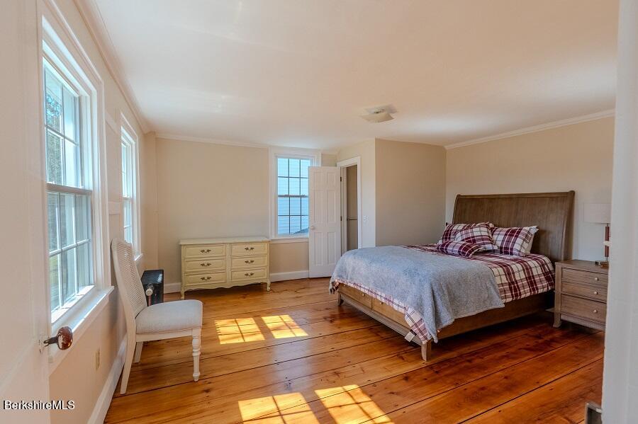 10 Goodell Road Lanesborough, MA 01237 - Photo 18 of 67 a bedroom with a bed and wooden floor