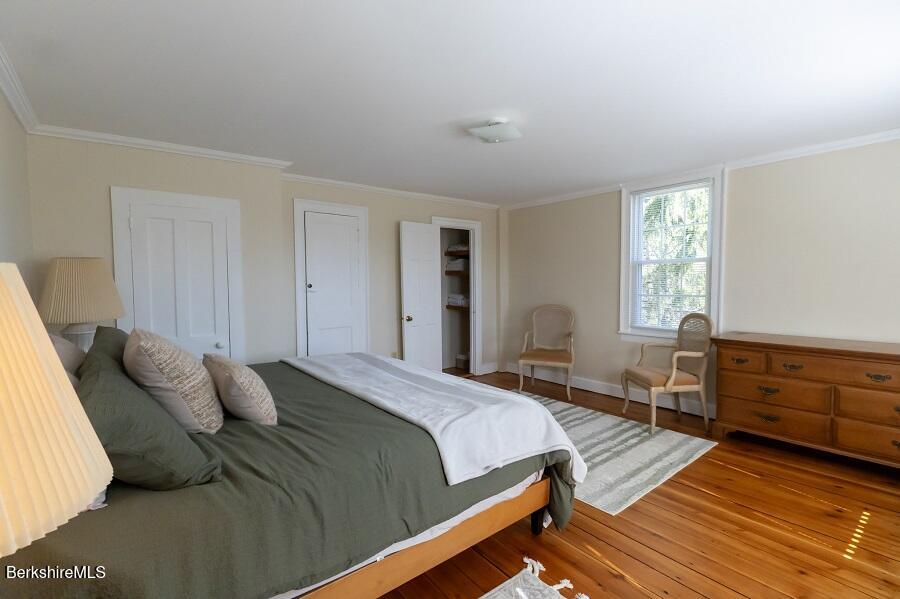 10 Goodell Road Lanesborough, MA 01237 - Photo 19 of 67 a bedroom with a bed and wooden floor