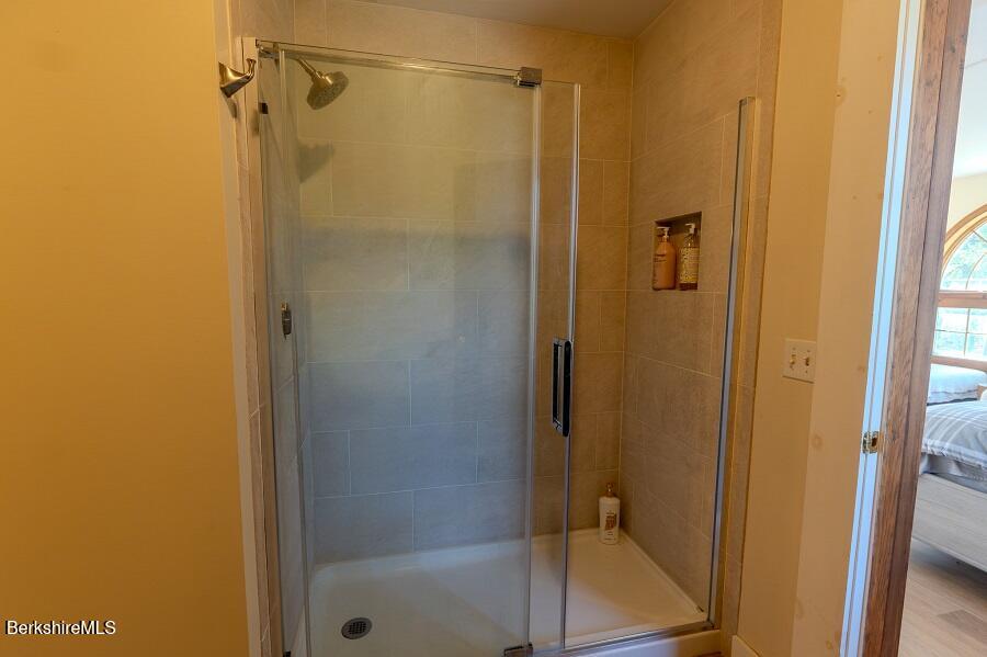 10 Goodell Road Lanesborough, MA 01237 - Photo 32 of 67 a bathroom with a glass shower door