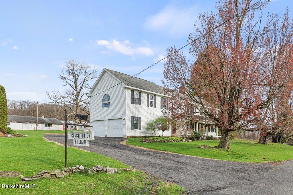 10 Goodell Road Lanesborough, MA 01237 - Photo 33 of 67 a view of a white house next to a yard and road