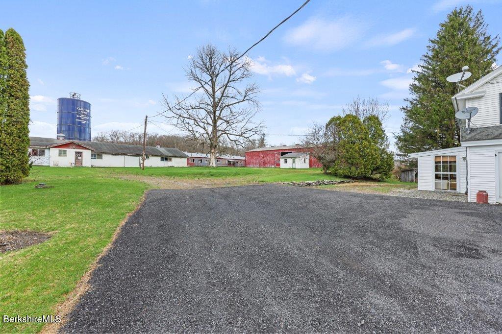 10 Goodell Road Lanesborough, MA 01237 - Photo 38 of 67 a view of a house with a yard and a garage