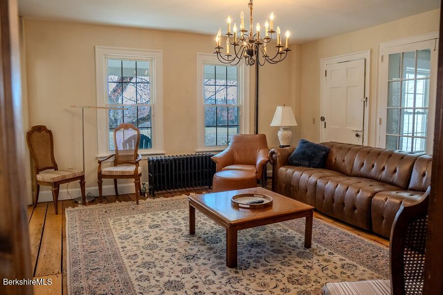 10 Goodell Road Lanesborough, MA 01237 - Photo 5 of 67 a living room with furniture a chandelier and a rug