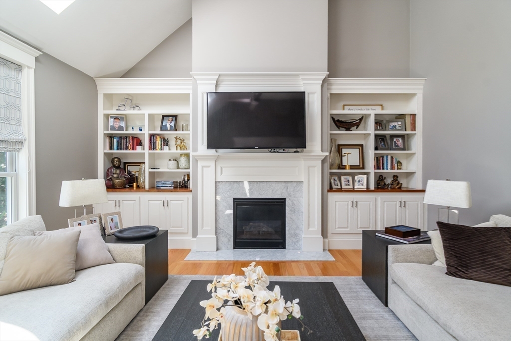 2 Hunters Lane Natick, MA 01760 - Photo 10 of 40 a living room with furniture fireplace and flat screen tv