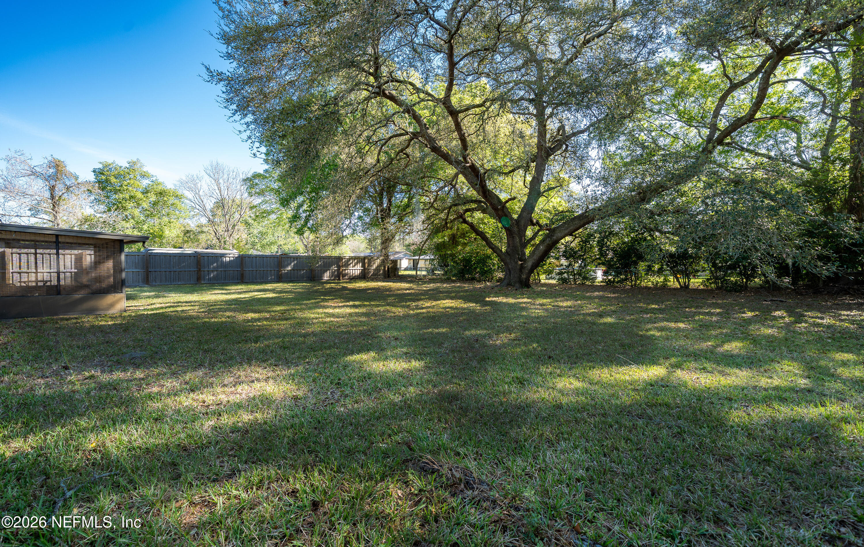 147 Knight Boxx Road Middleburg, FL 32068 - Photo 24 of 30 a view of outdoor space with trees all around