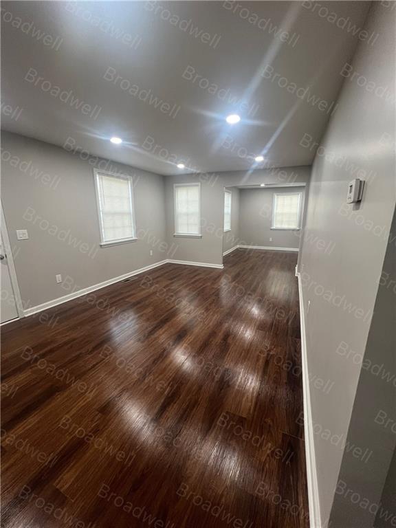 1860 Broadwell Street Southwest Atlanta, GA 30310 - Photo 11 of 23 a view of an empty room with wooden floor