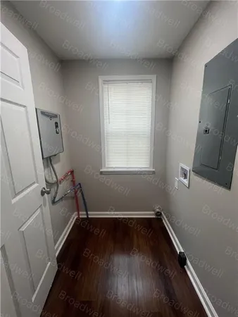 a kitchen with granite countertop a refrigerator and a sink