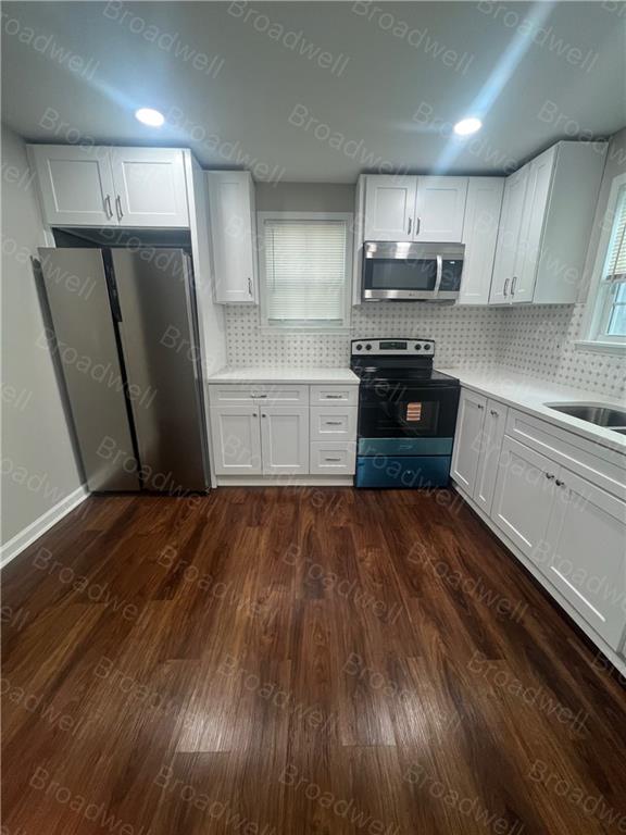 1860 Broadwell Street Southwest Atlanta, GA 30310 - Photo 13 of 23 a kitchen with granite countertop a refrigerator and a sink