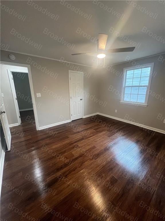 1860 Broadwell Street Southwest Atlanta, GA 30310 - Photo 14 of 23 an empty room with wooden floor and windows