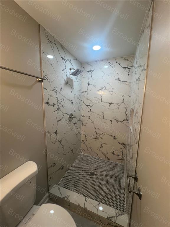 1860 Broadwell Street Southwest Atlanta, GA 30310 - Photo 16 of 23 a bathroom with a toilet and a shower