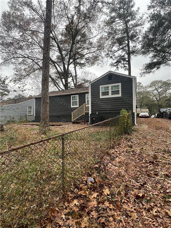 1860 Broadwell Street Southwest Atlanta, GA 30310 - Photo 23 of 23 a house that has a tree in front of the house