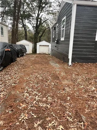 a couple of cars parked in front of a house