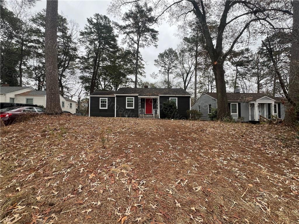 1860 Broadwell Street Southwest Atlanta, GA 30310 - Photo 5 of 23 a front view of a house with a yard