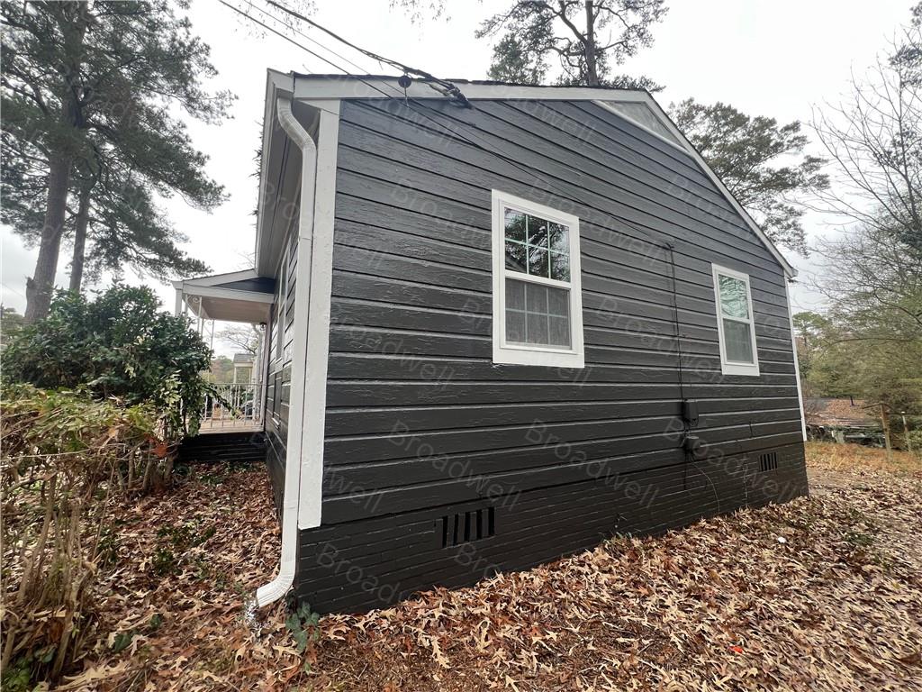 1860 Broadwell Street Southwest Atlanta, GA 30310 - Photo 6 of 23 a back view of a house with a yard