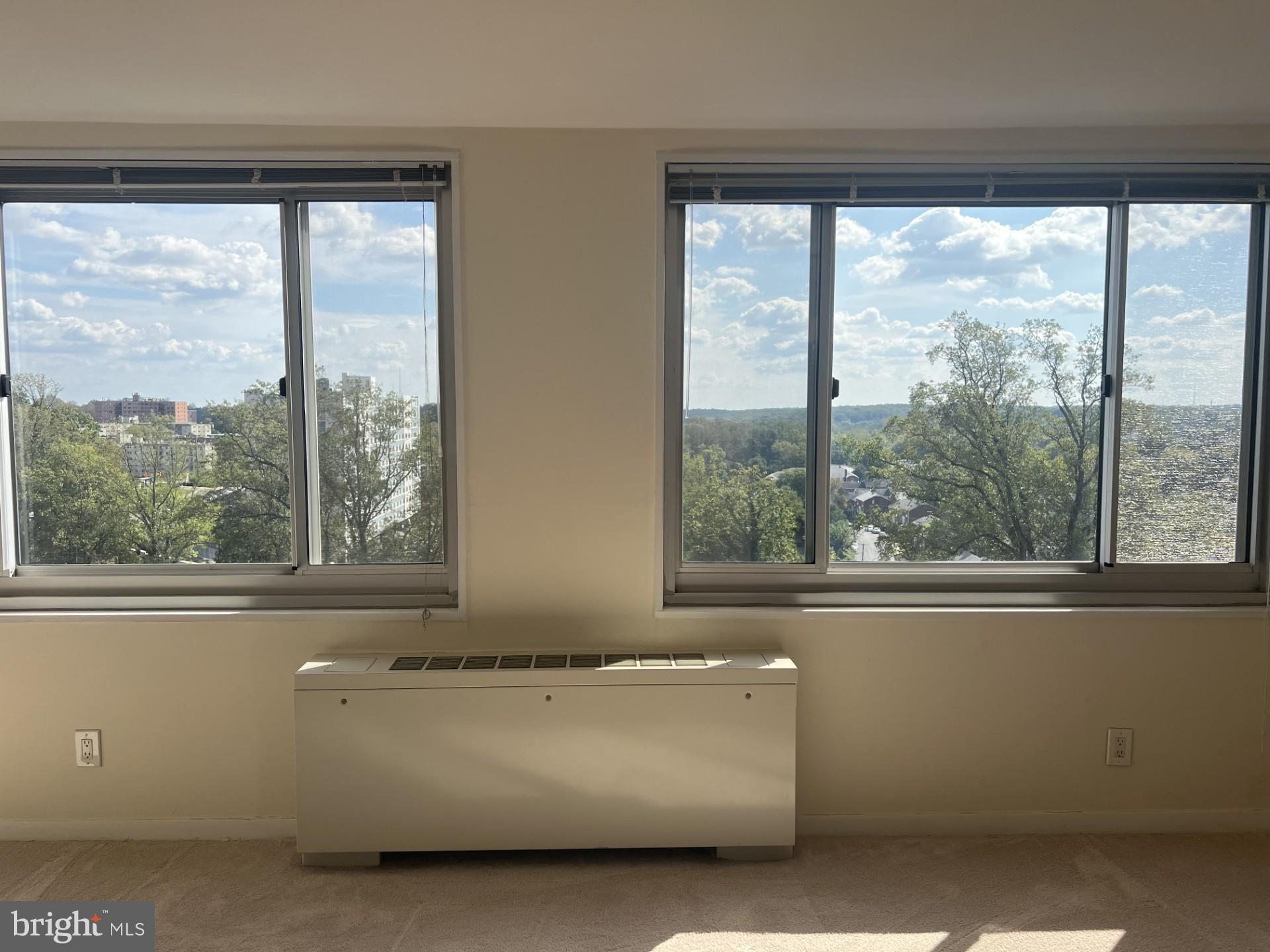 1900 Lyttonsville Road, Unit 1308 Silver Spring, MD 20910 - Photo 26 of 52 a living room with a large window