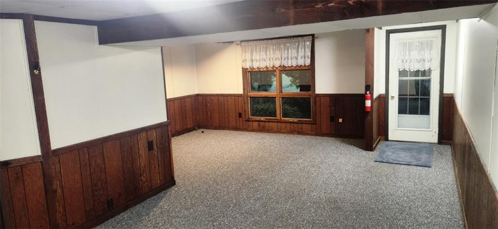 4534 Ellwood Road New Castle, PA 16101 - Photo 37 of 42 Lower level game room w/ walkout access to rear yard and private patio