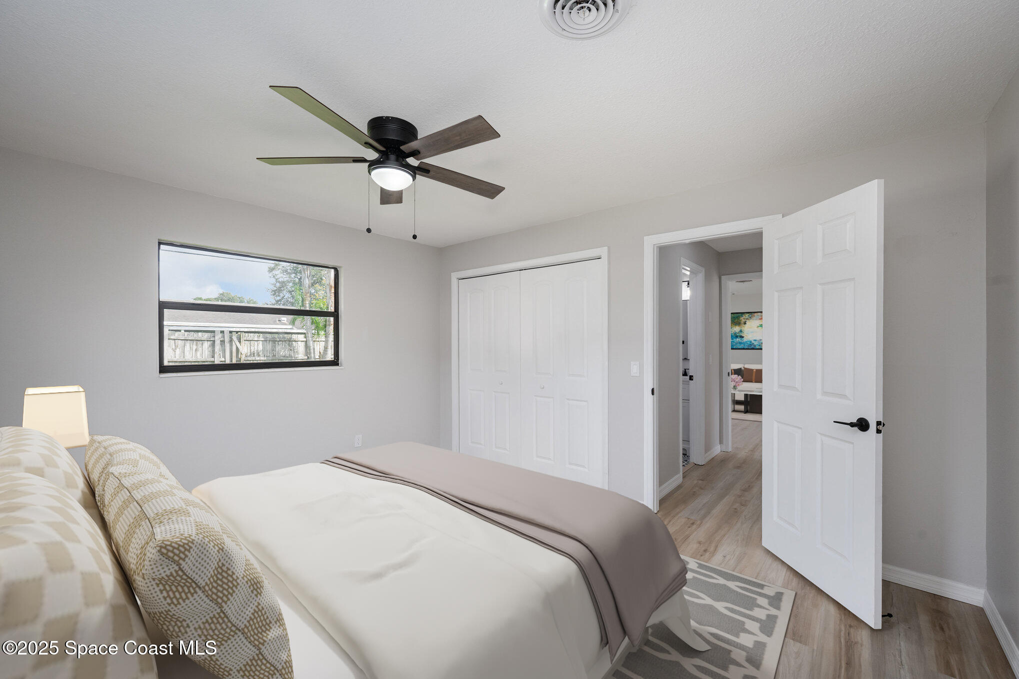 980 Miracle Way Rockledge, FL 32955 - Photo 16 of 33 a bedroom with a bed and a window