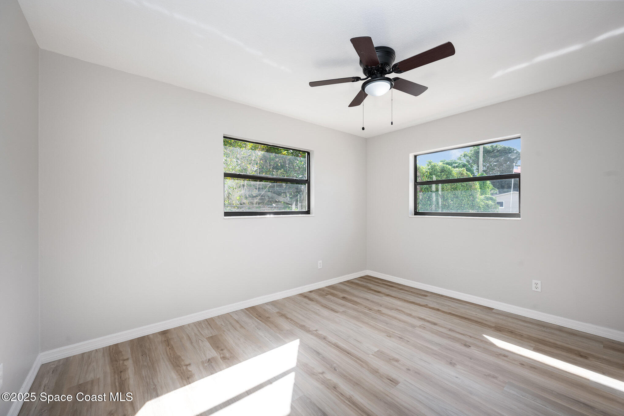 980 Miracle Way Rockledge, FL 32955 - Photo 22 of 33 a view of empty room with wooden floor