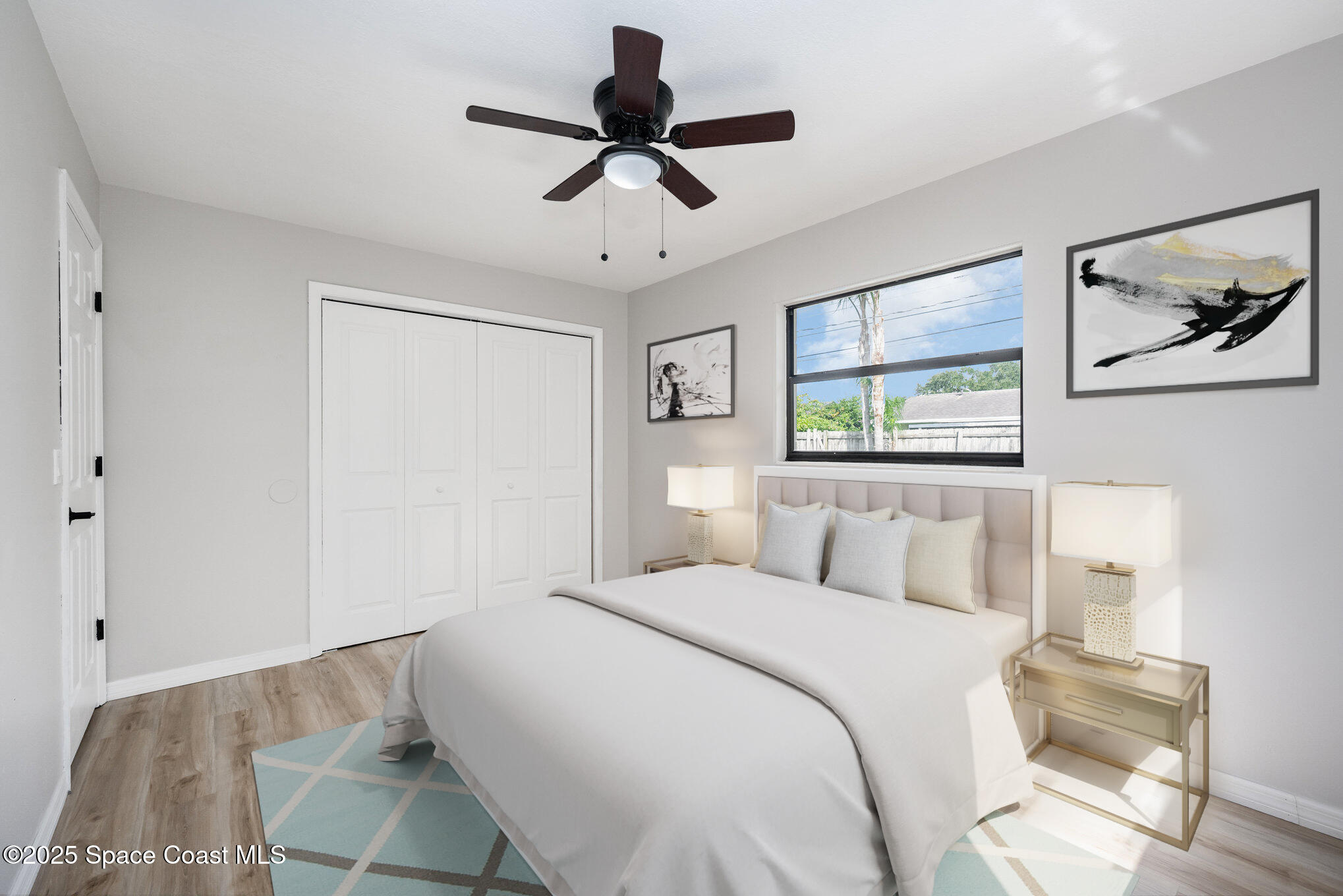 980 Miracle Way Rockledge, FL 32955 - Photo 25 of 33 a bedroom with a bed and a painting on the wall