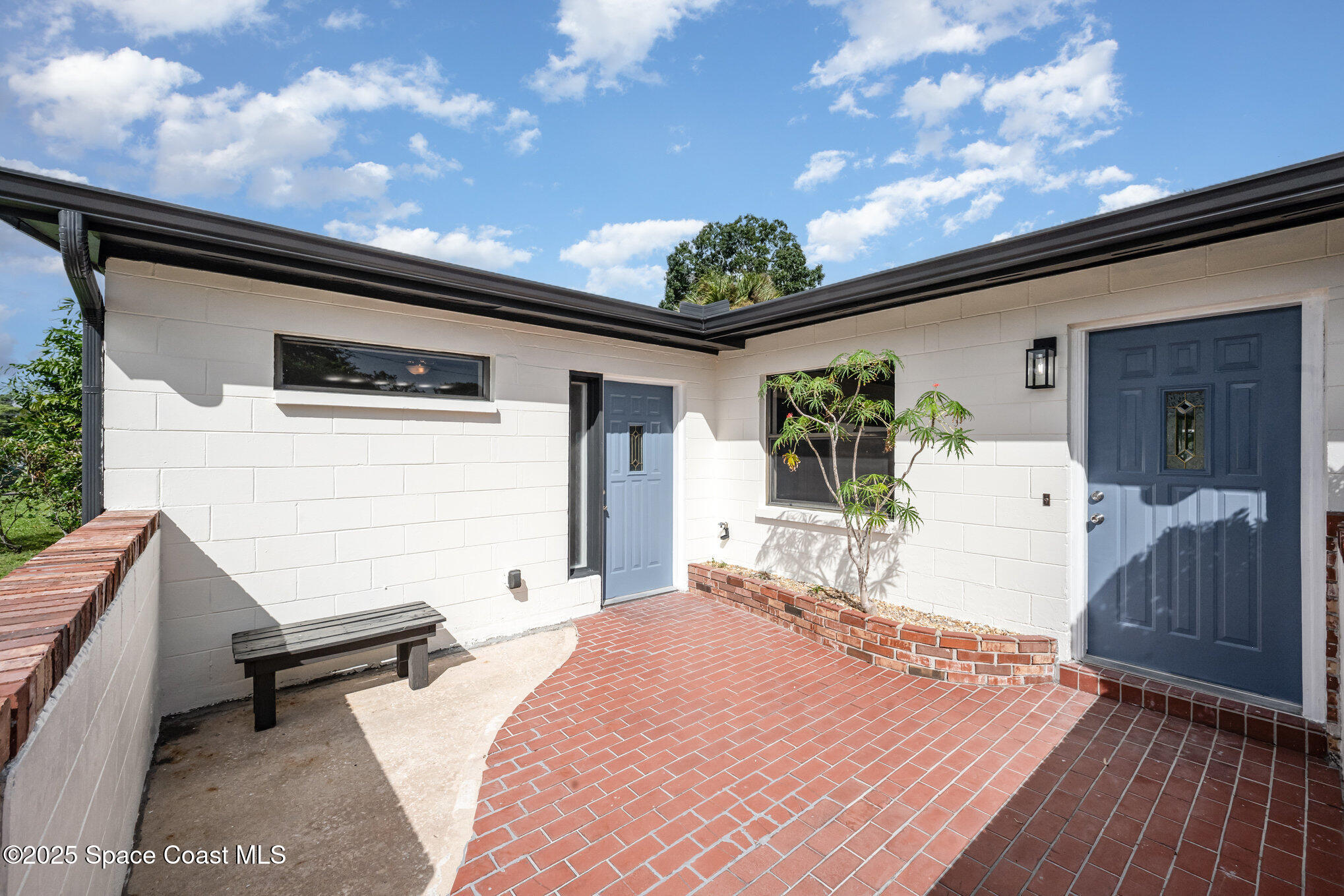 980 Miracle Way Rockledge, FL 32955 - Photo 4 of 33 a front view of a house with garden