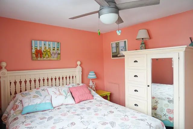 a bedroom with a bed and a dresser