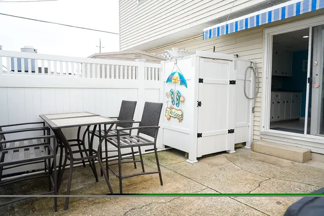 a view of balcony with furniture and barbeque oven