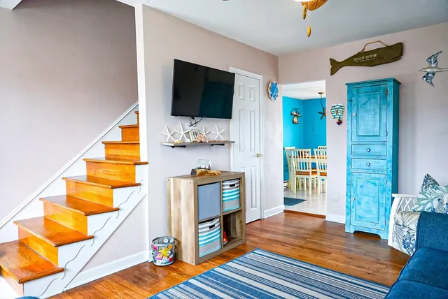 a living room with furniture and a flat screen tv
