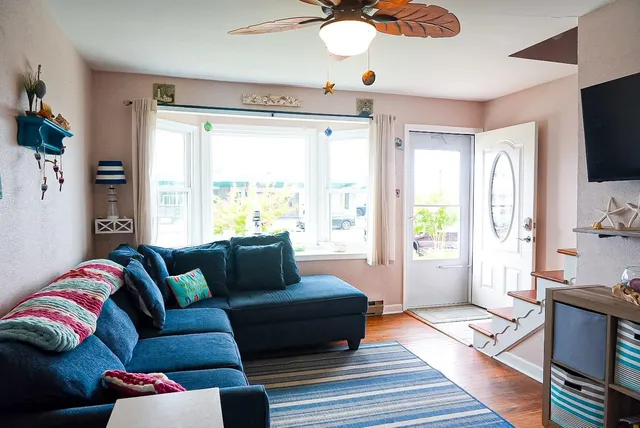 a living room with furniture and a flat screen tv