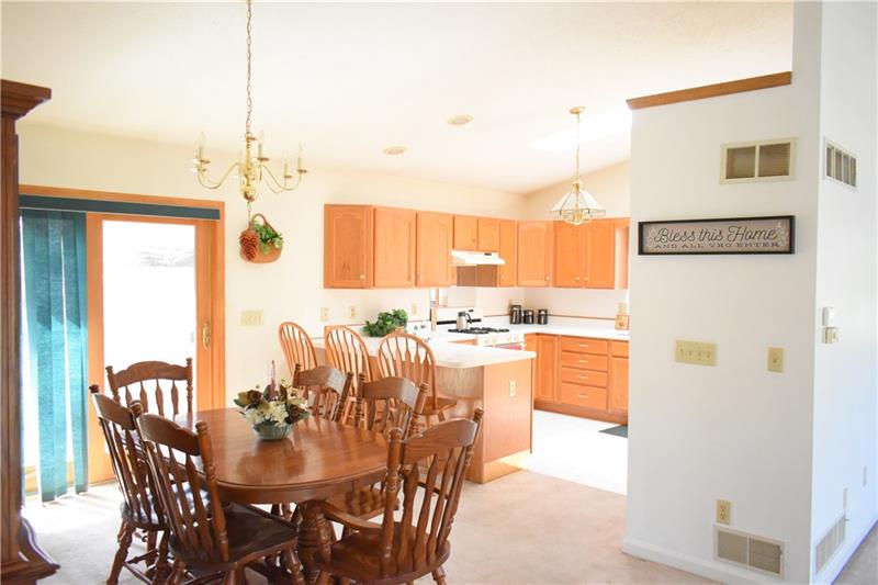 102 Moore Road Butler, PA 16001 - Photo 5 of 18 Combined kitchen and dining room. Patio doors lead to the back deck.