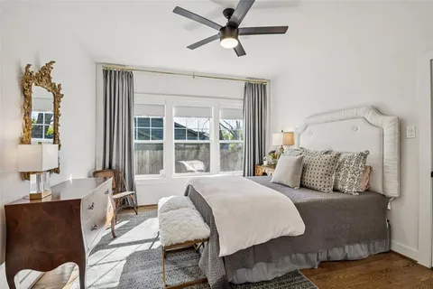 a bedroom with furniture and windows