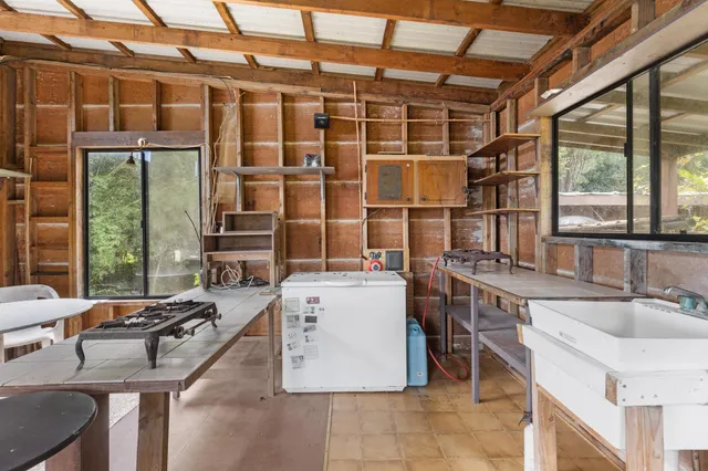 a lobby with furniture and floor to ceiling window