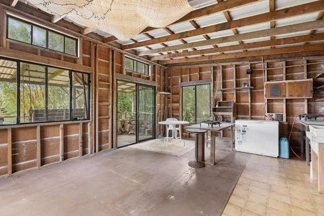 a view of balcony with wooden floor