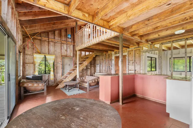 a view of livingroom with furniture and floor to ceiling window